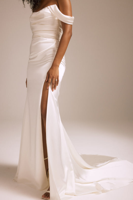 NouvelleAmsale_Bridal_SYD_R453FS_FluidSatin_Off-The-Shoulder_Fit-To-FlareGown_DrapedSkirt_Slit_Mood4_540x.jpg